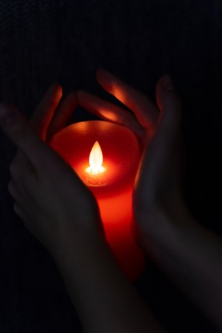 view-hands-holding-candle-light 1